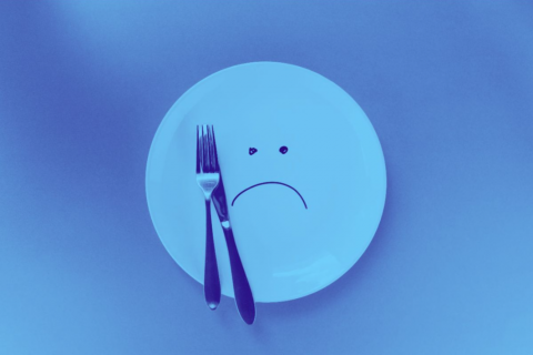 Empty plate with sad face