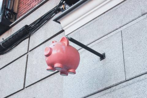 Piggy bank hanging from a wall