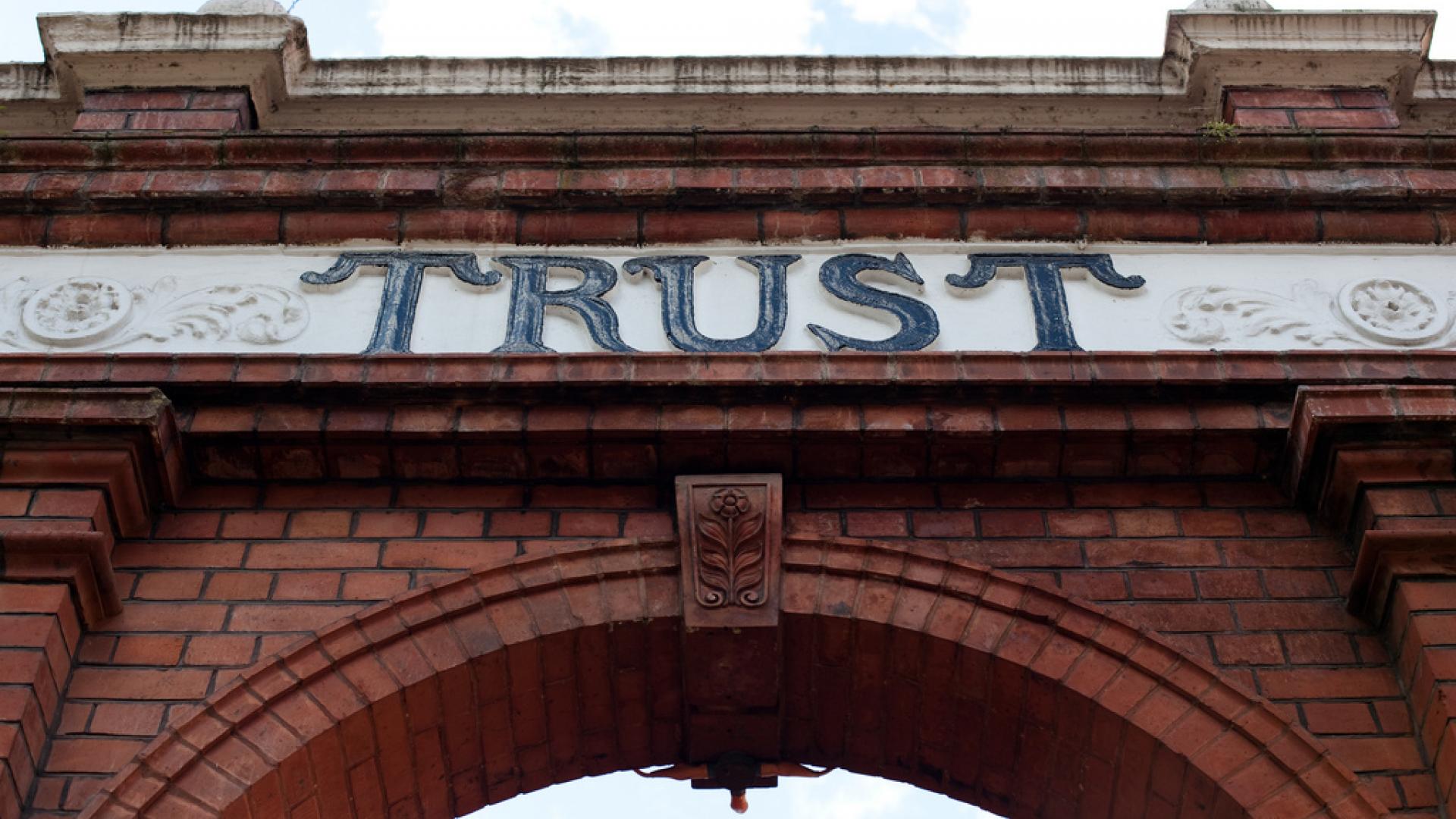 Image of arch with trust written on it